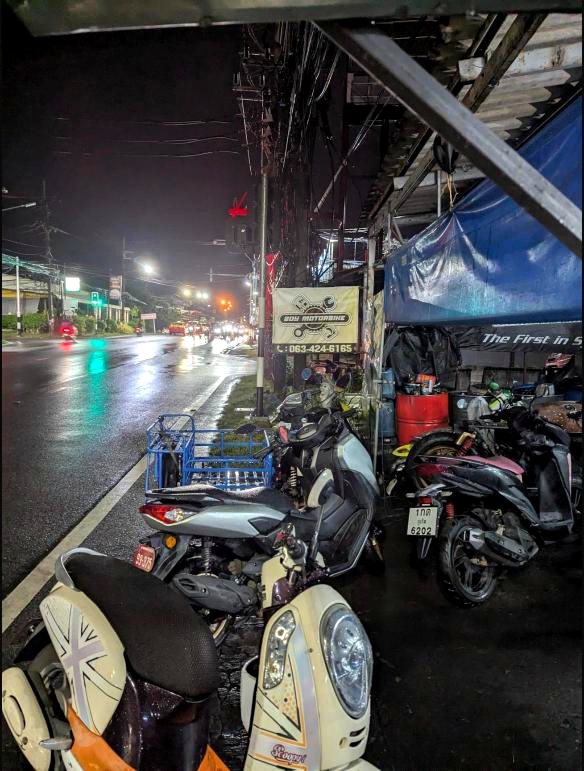 Boy Motorbike workshop at night in the rain, Chaofah East Rd
